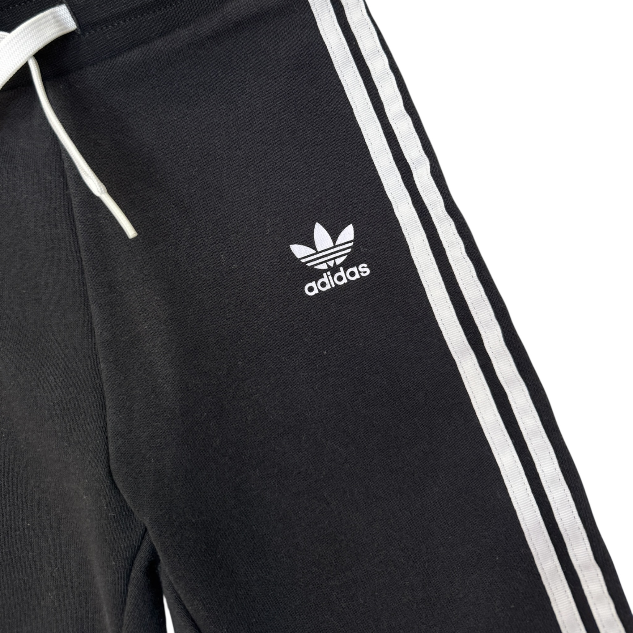 Černé tepláky s bílými pruhy ADIDAS
