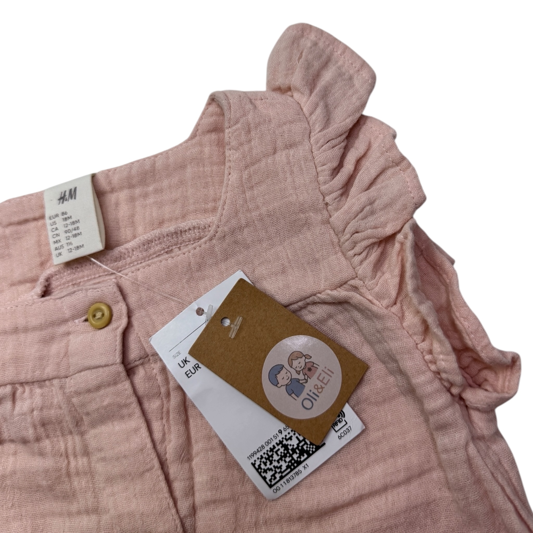 Růžový mušelínový overal s volánky H&M
