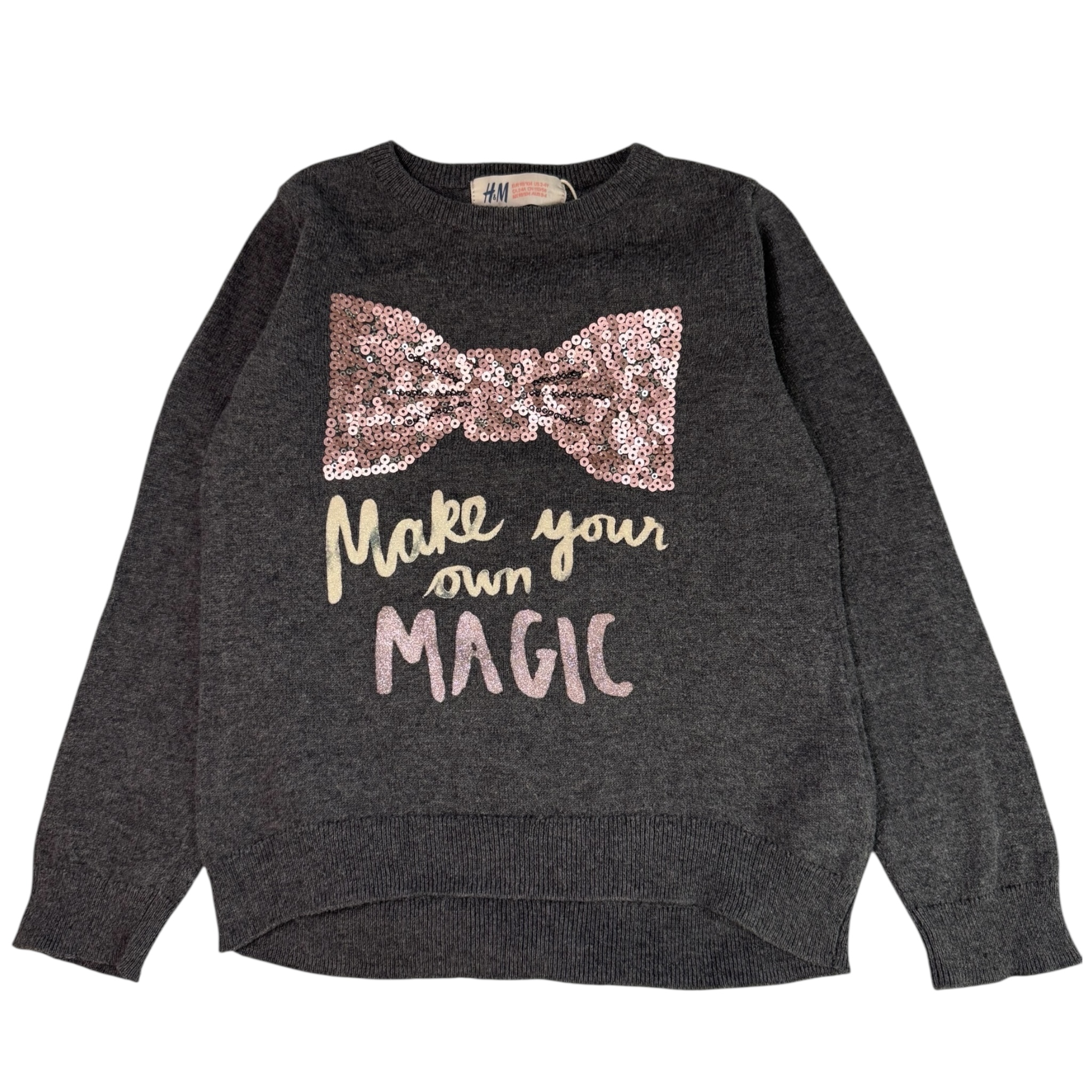 Šedý svetr s mašli z flitrů H&M