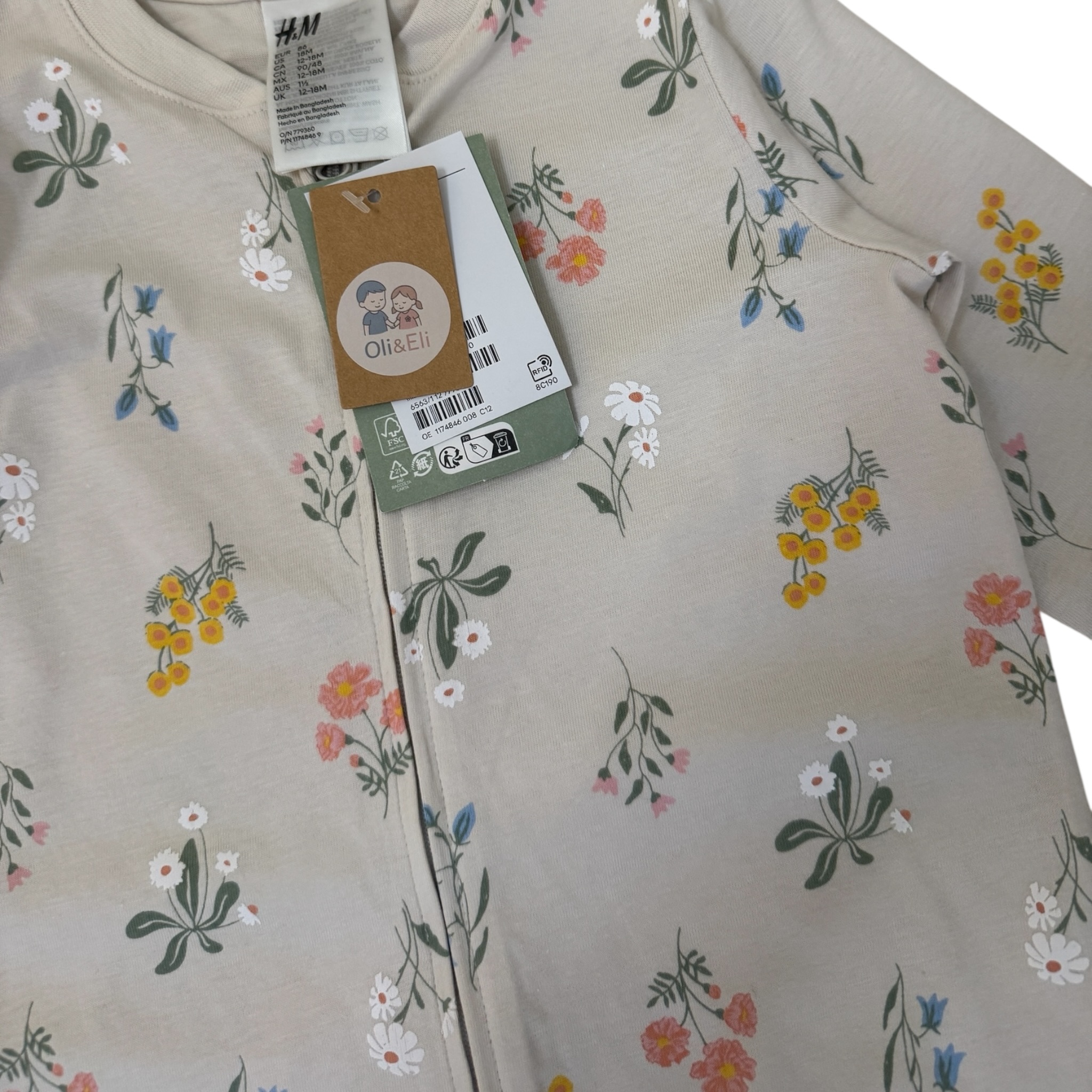Krémový overal na spaní s kytičkami na zip H&M